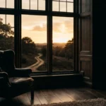 A quiet wood-panelled study with a winding path visible through the window at golden hour, symbolising life reinvention after 40