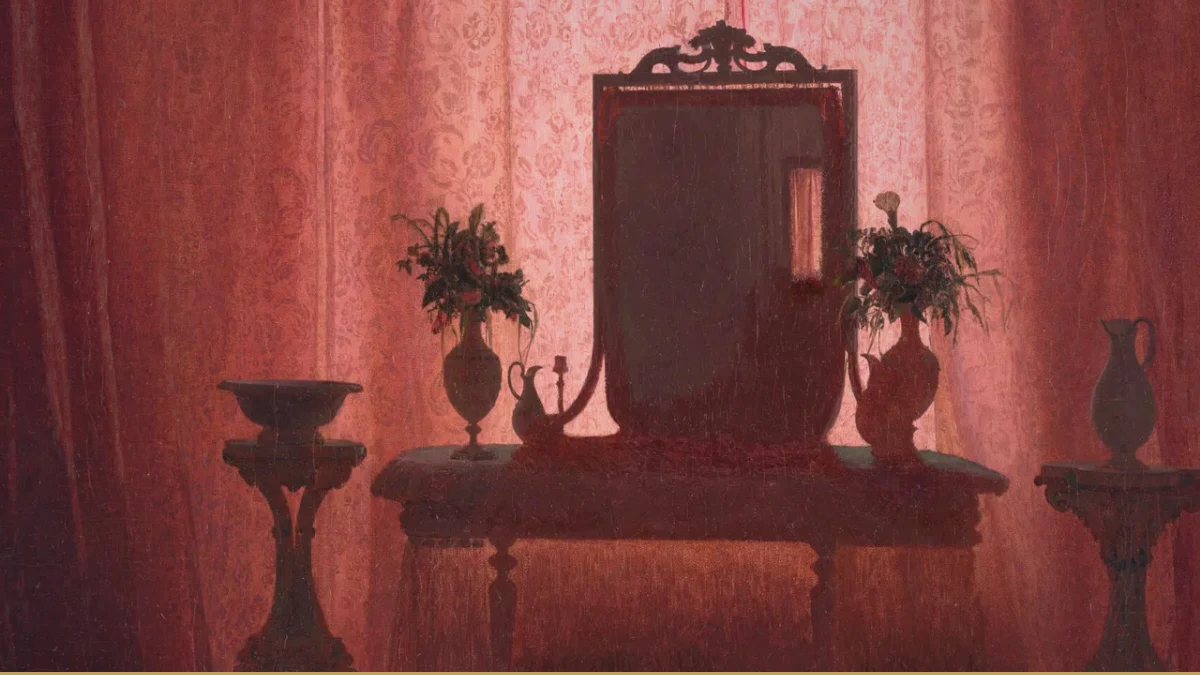 Detail of a nineteenth-century interior: an empty room with a dark mirror on rose patterned wallpaper, flanked by vases of dried flowers.