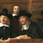 Four men in wide black hats and white collars sit behind a red covered table with an open ledger; a bareheaded man stands among them, all looking out