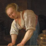 Detail of a Dutch genre painting: a young woman in a white blouse bends over a brass foot warmer in a kitchen and looks up at the viewer.