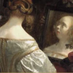 Detail of a Dutch genre painting: a woman in white satin, seen from behind at her dressing table, her face reflected in a small mirror.