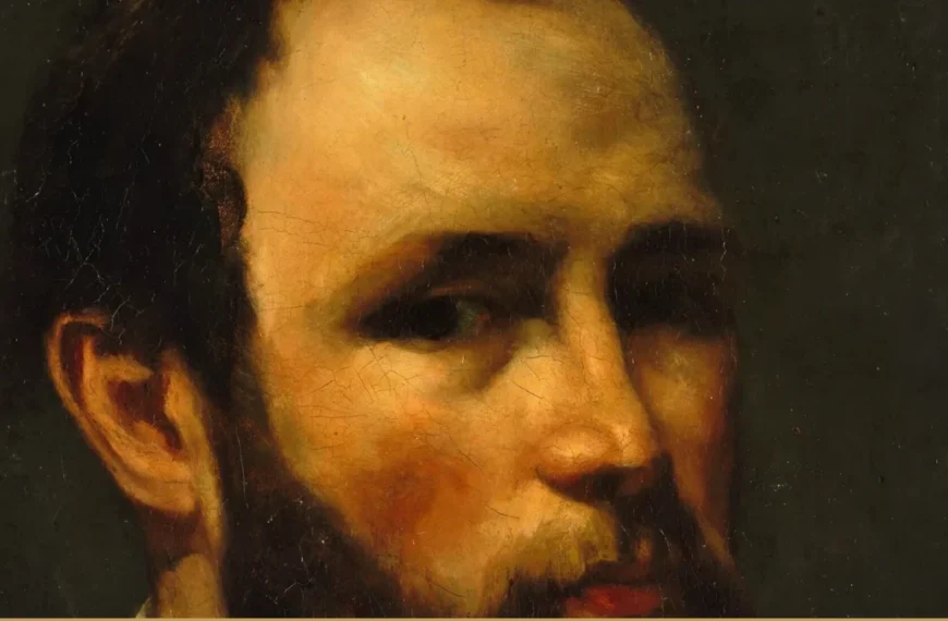 Detail of a Courbet portrait: a bearded man's face lit sharply from the left, the top of his head cropped by the frame.