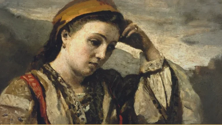 A young woman in a headscarf and embroidered blouse rests her head against one hand, eyes lowered, leaning on a stone wall under a grey sky.