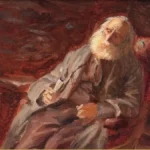 An elderly man with a long white beard leans back in a red studio chair holding a pipe, beside a small table with an orange, in warm brown tones.